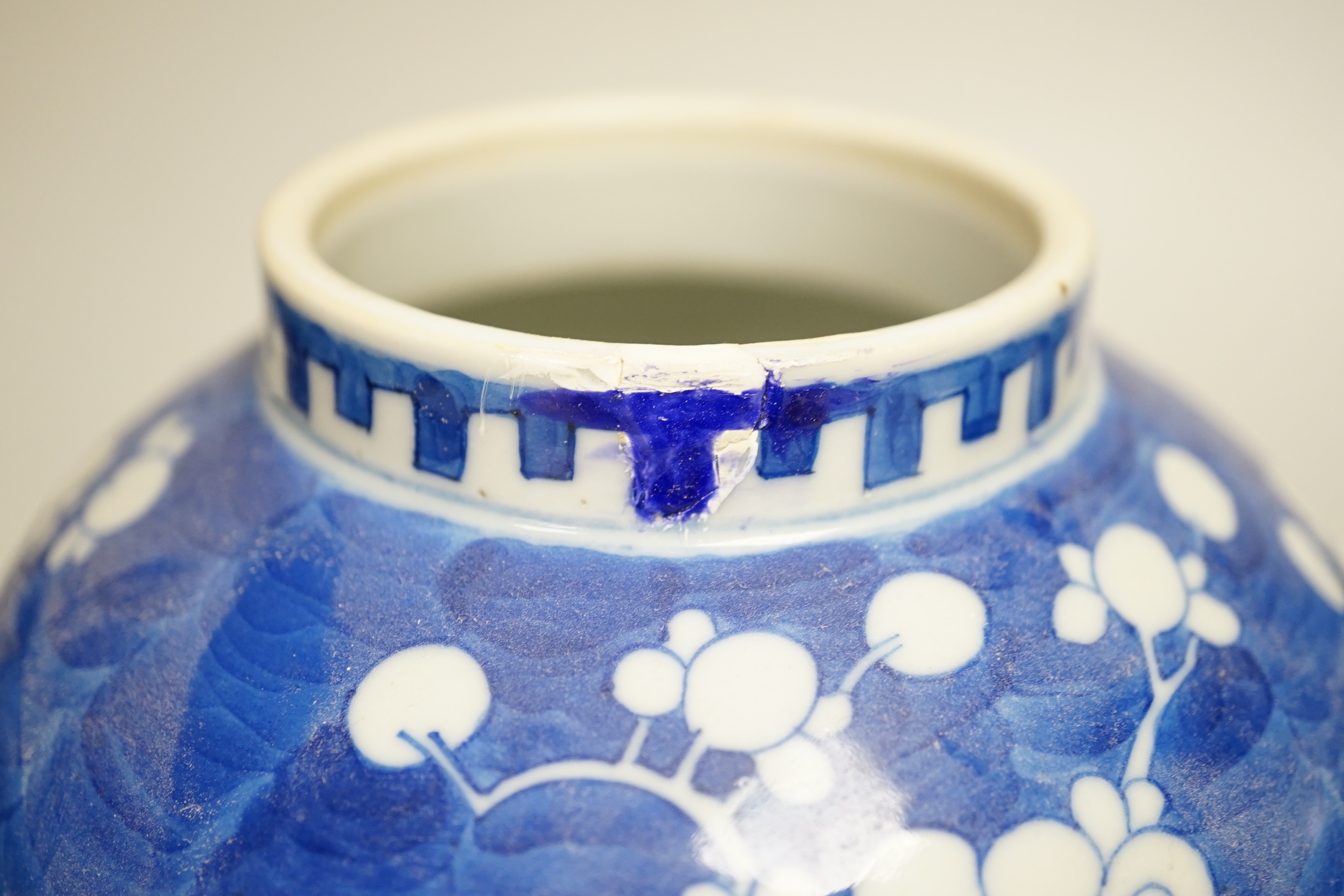 A pair of Chinese blue and white prunus pattern vases and covers, 21cm high